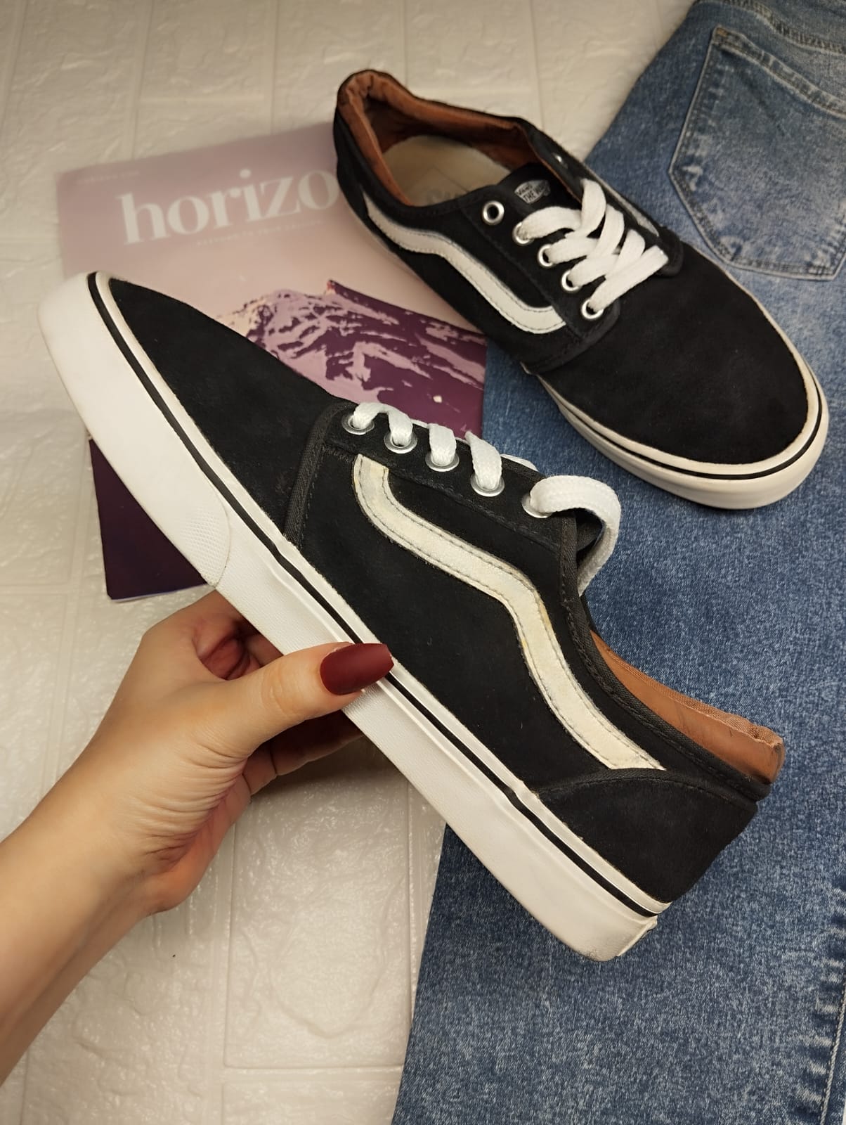Black and brown low rise vans